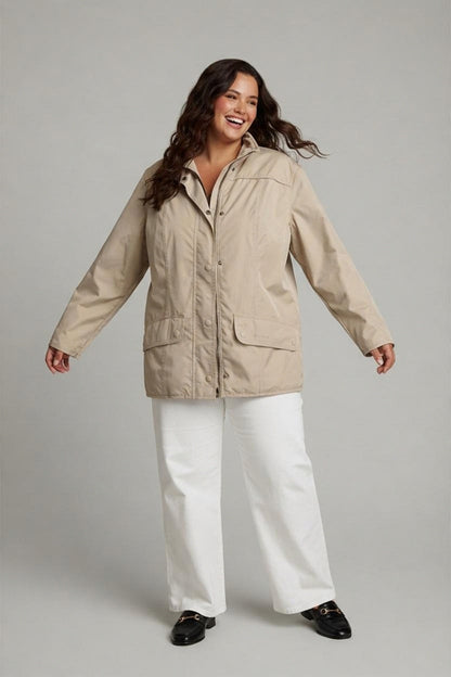 AI-generated photo of the jacket worn by a model, showing the front of the beige jacket with a zip and popper fastening, two flap pockets, and a high collar.
