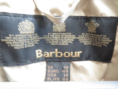 Inside neck label reading Barbour, with royal warrant text, and size markings UK 18, EURO 44, USA 14, BL/FR 46.